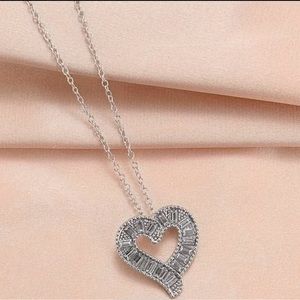 Silver heart shaped diamond necklace